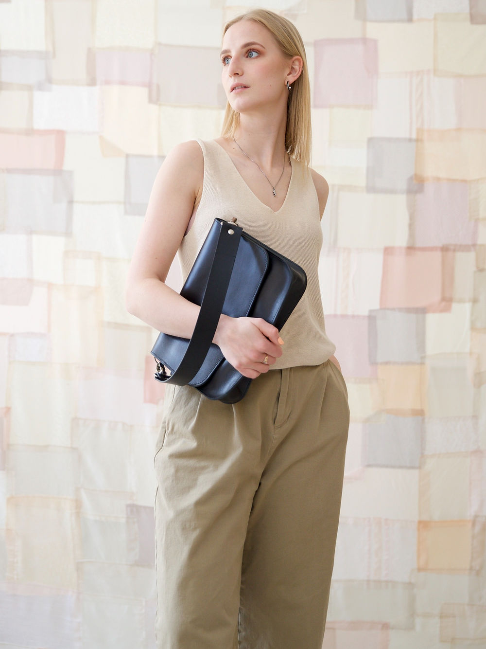 Toks Visoks collection at Sostter: Playful accessories, including bold tote bags, colorful scarves, and quirky stationery.