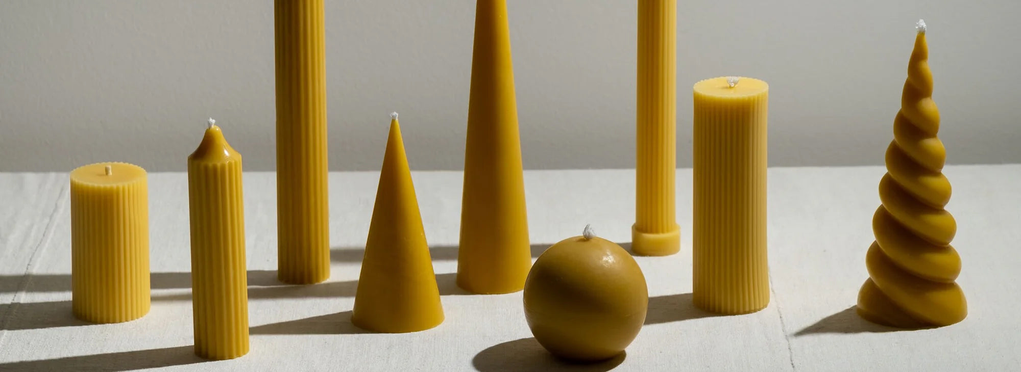 BZZWAX pure organic beeswax candles hand-poured in London - 100% natural cotton wick pillar and sculptural candles from an independent British brand at Sostter
