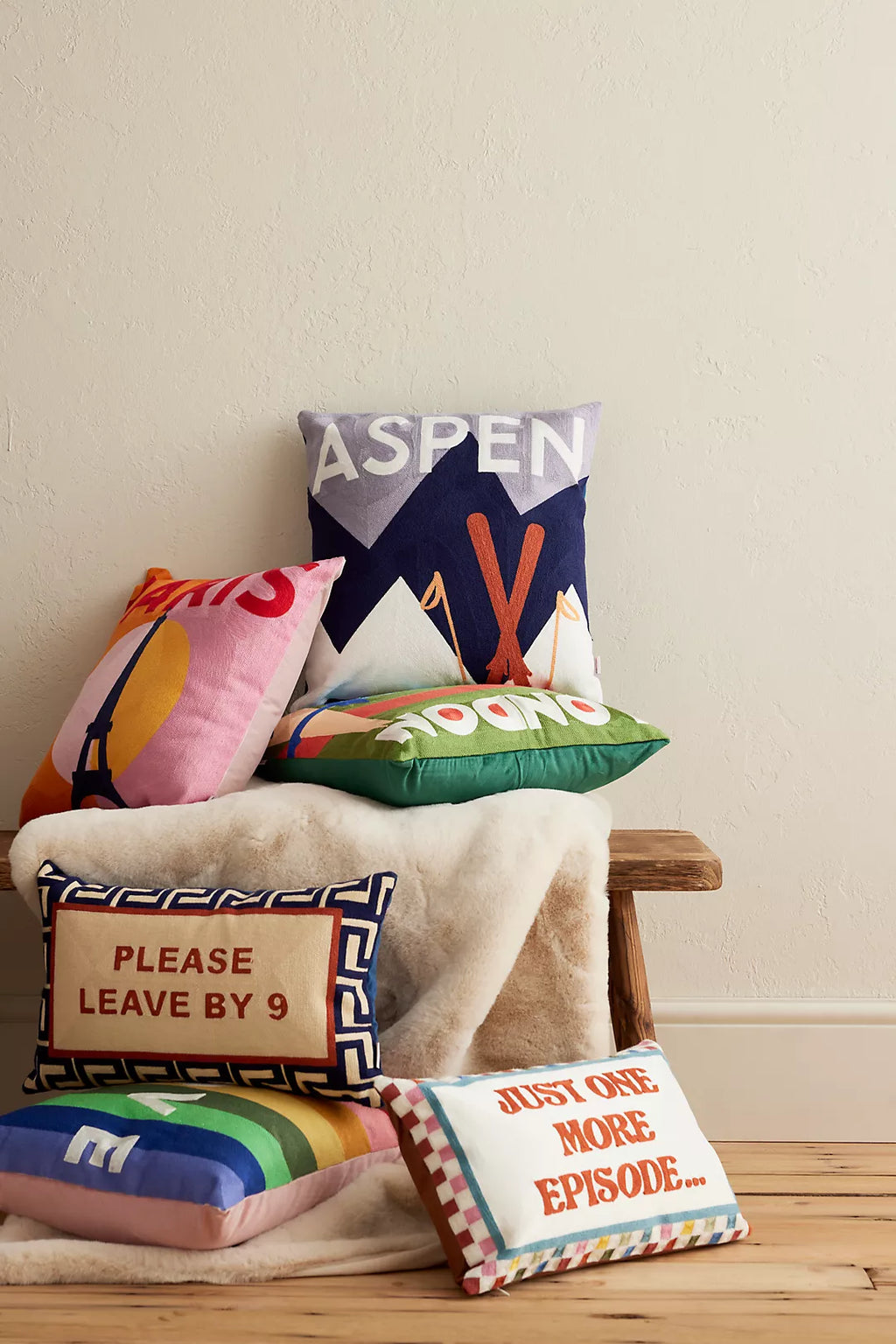 The Pillow Drop handmade needlepoint cushions made in Britain by Mitch and Misty - city and slogan range velvet backed cushions at Sostter