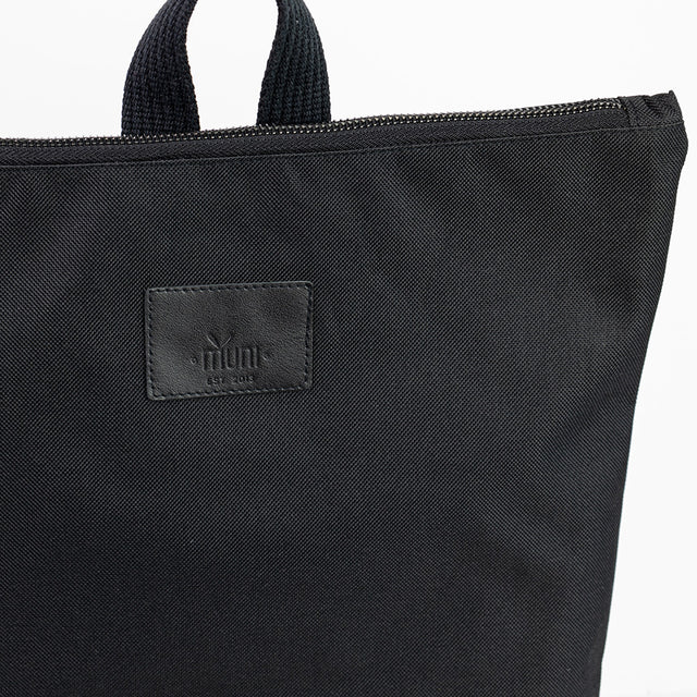 Stylish Black & Tan Leather Backpack – Waterproof & Spacious by Muni at www.brixbailey.com