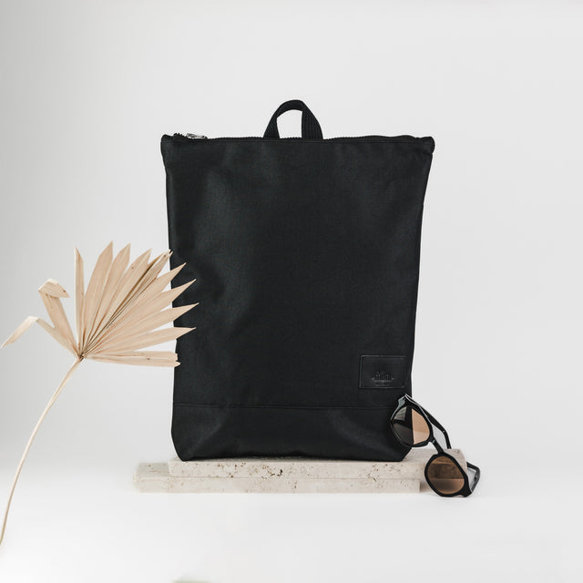 Stylish Waterproof Black Leather Backpack for Everyday Use by Muni at www.brixbailey.com