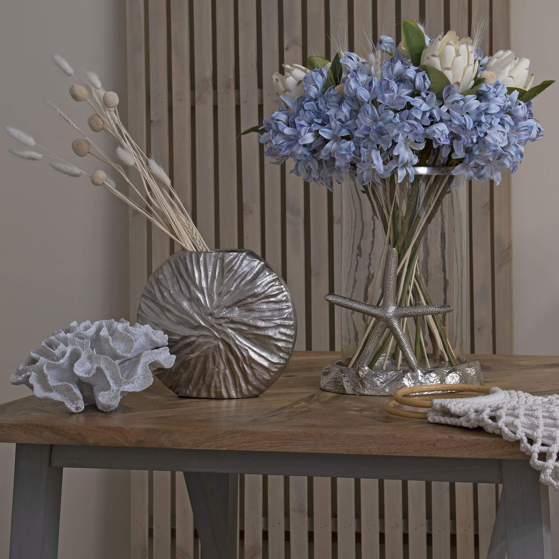 Lifelike artificial Agapanthus bloom in soft light blue with natural cluster details, perfect for coastal home decor. by Sostter at brixbailey.com