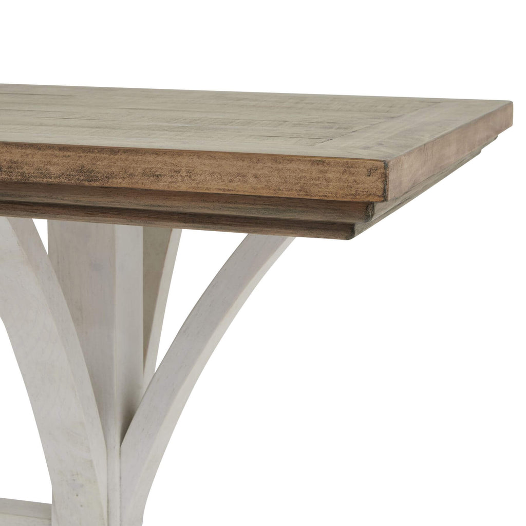 Handcrafted pine bar table with white base, rustic-modern style, showcasing natural wood grain for dining or entertaining. by RoomLondon at brixbailey.com
