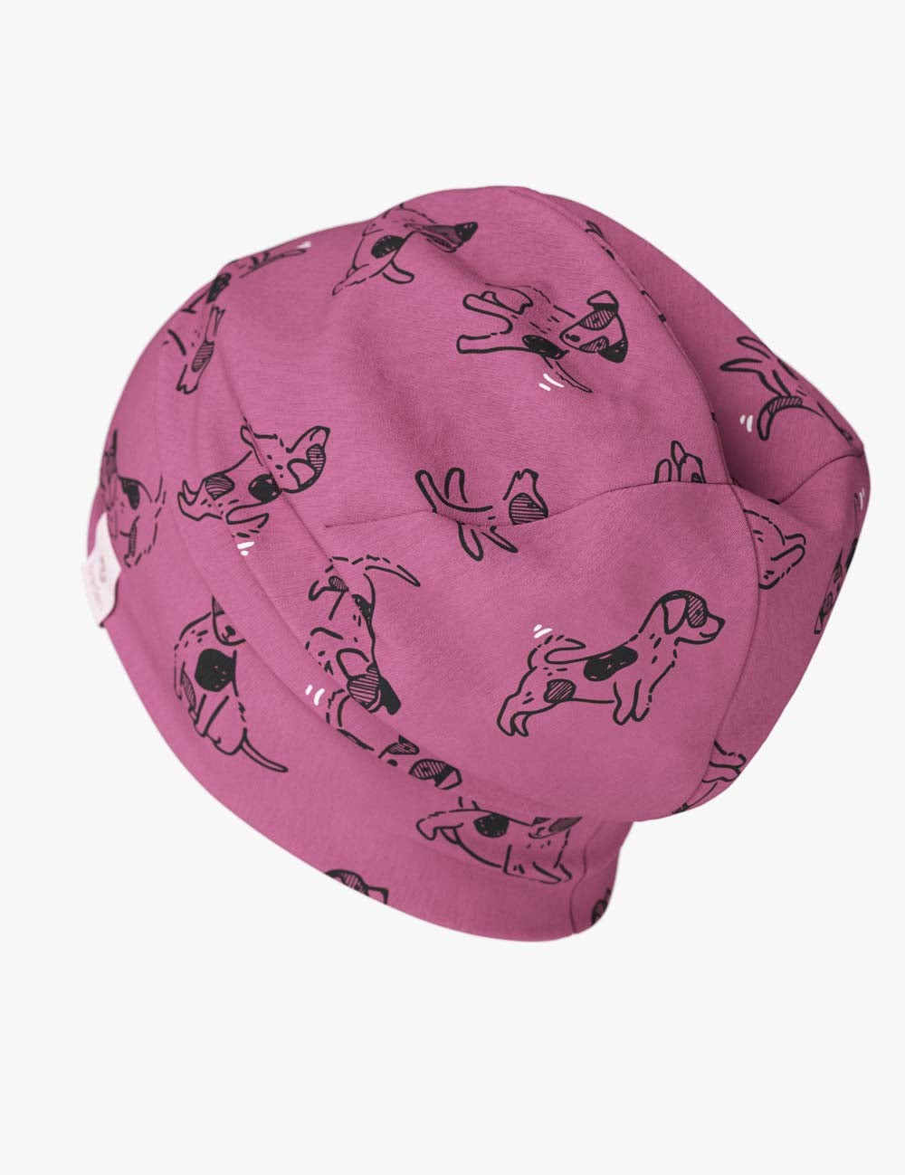 bold pink dog pattern beanie for kids on a bright studio background