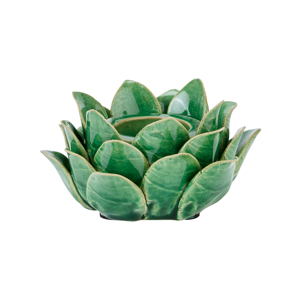 Handcrafted ceramic tea light holder in botanical green with artichoke cutouts, casting intricate shadow patterns. by RoomLondon at brixbailey.com