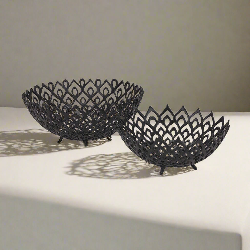 Matte black aluminum lattice bowl with geometric perforations, modern sculptural centerpiece for home decor by Sostter at brixbailey.com