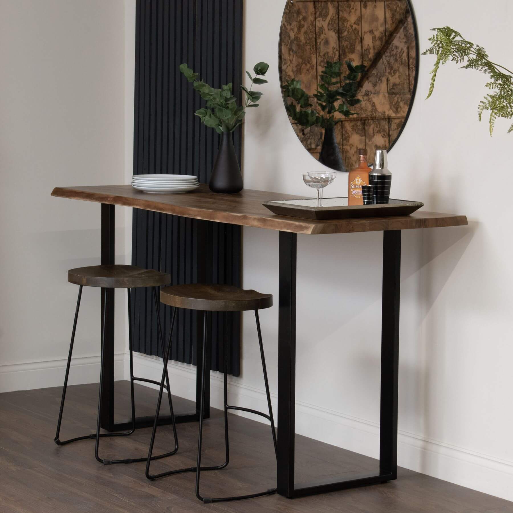 Live edge acacia wood bar table with black metal base, showcasing natural grain and rustic-industrial style. by RoomLondon at brixbailey.com
