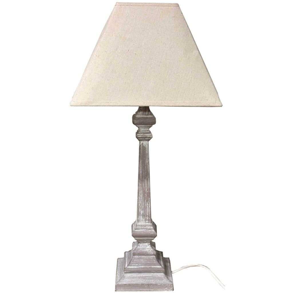 Handcrafted whitewashed wood table lamp with linen shade, warm white finish and visible wood grain, rustic farmhouse decor by Sostter at brixbailey.com
