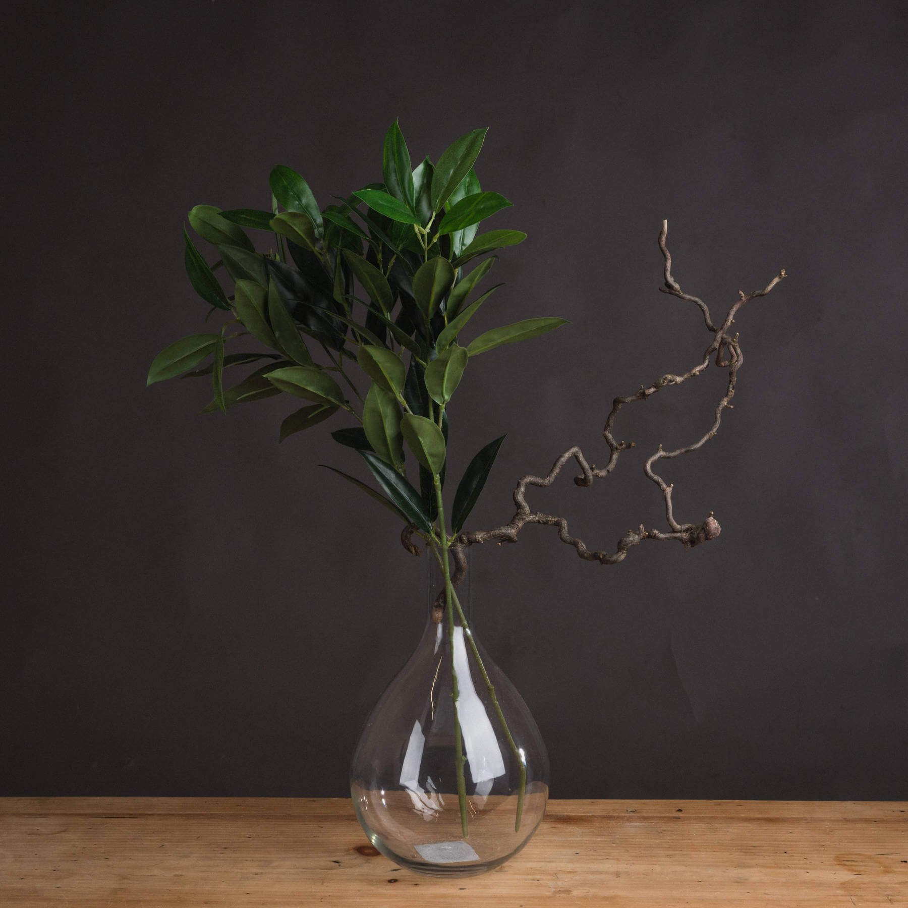 Lifelike faux bay leaf spray with emerald green leaves, 75cm tall, for Mediterranean decor by RoomLondon at brixbailey.com