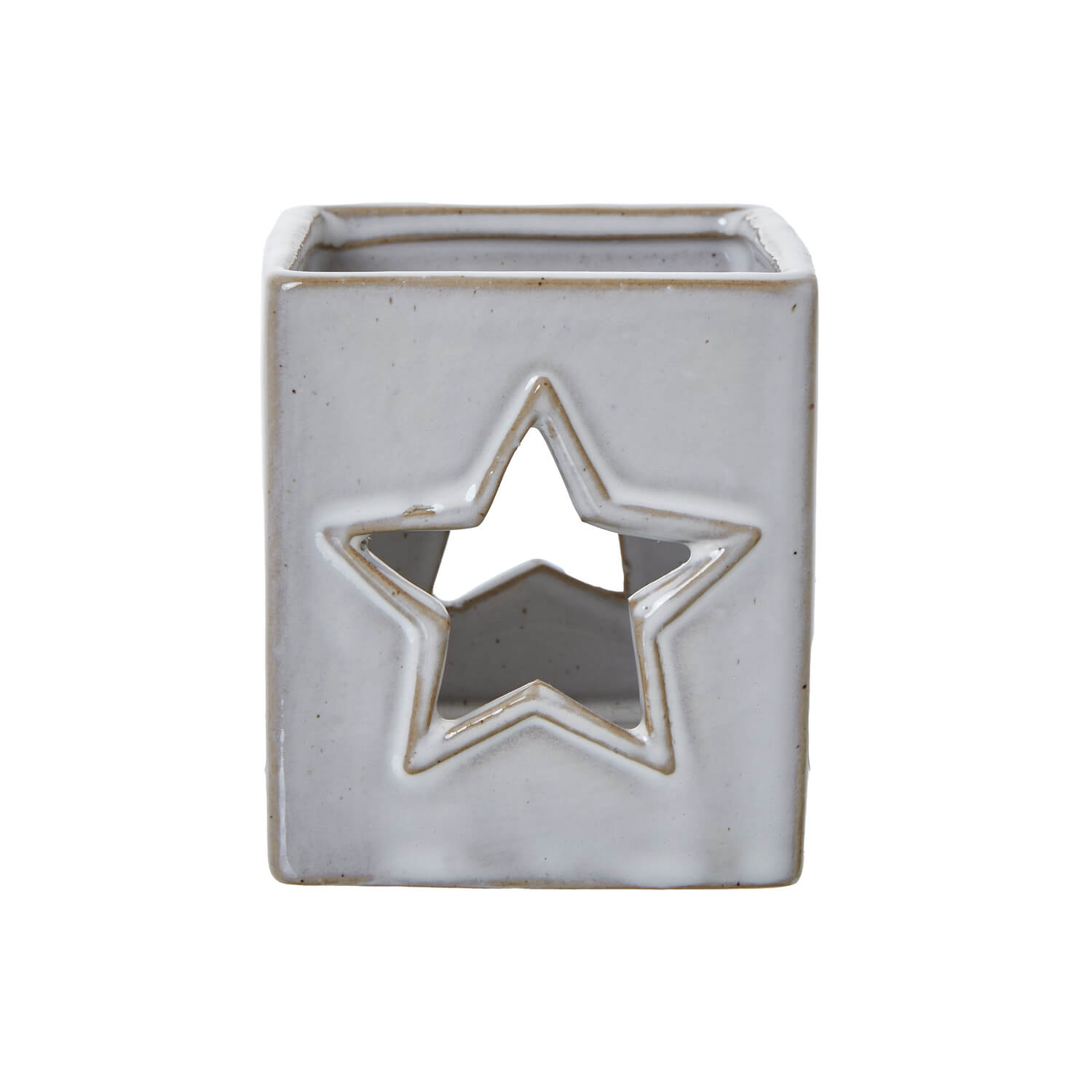 White ceramic tealight holder with star cut-outs, casting delicate light patterns, minimalist home decor. by sostter at brixbailey.com