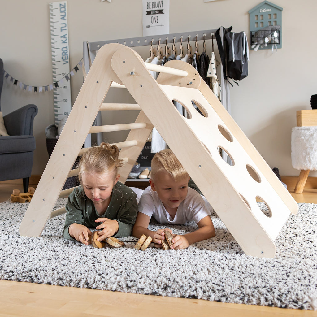 foldable montessori climbing triangle in use by toddler, set at 20.08 height for compact play