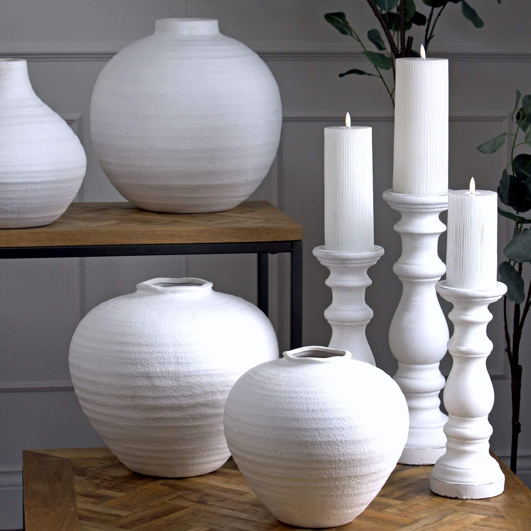 Minimalist white ceramic column holder with silver pinecone finial, perfect for candles and modern decor. by RoomLondon at brixbailey.com