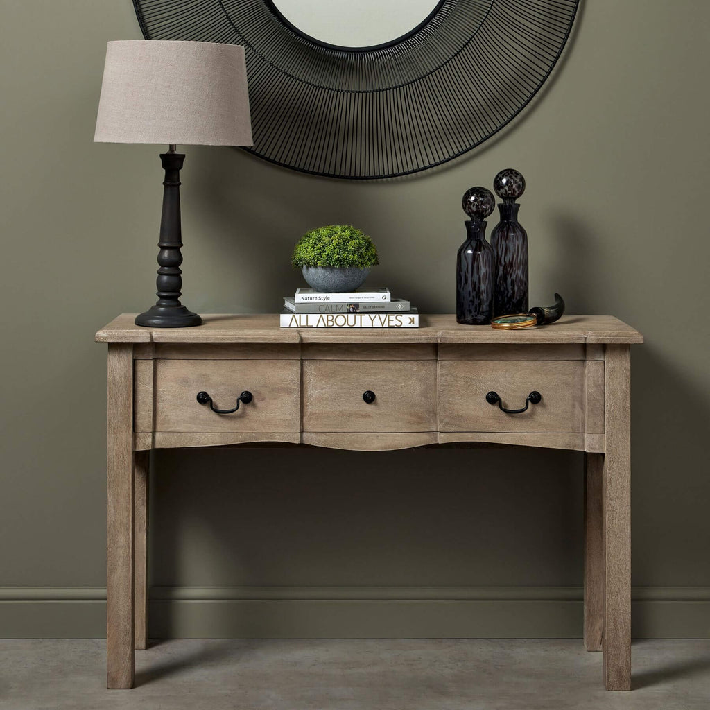 French provincial hardwood console with bleached finish, black iron handles, and spacious drawer for elegant storage. by sostter at brixbailey.com