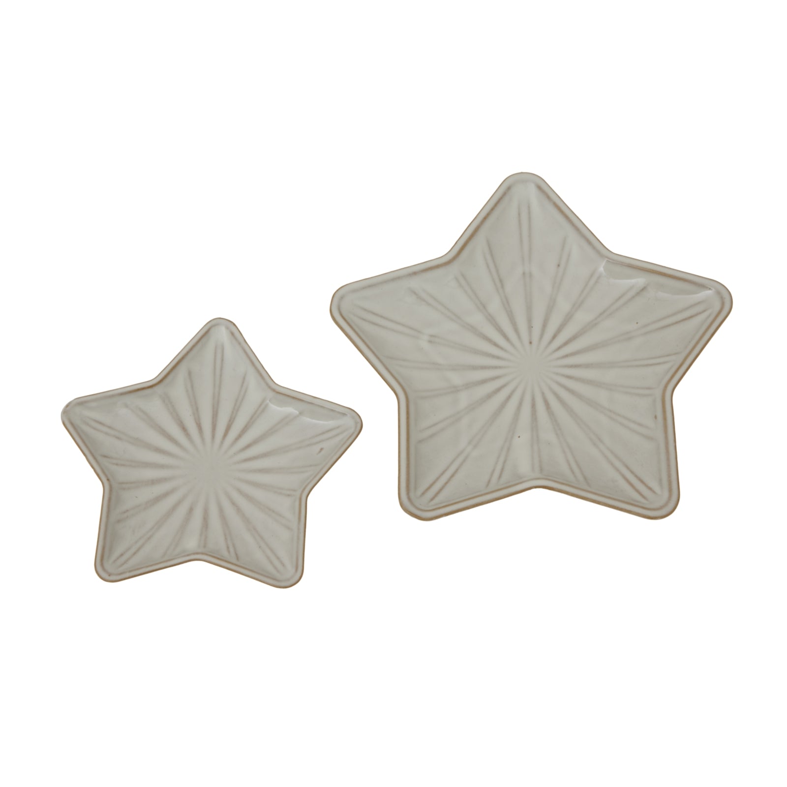 a playful white ceramic star dish casting whimsical shadows on a sunny table
