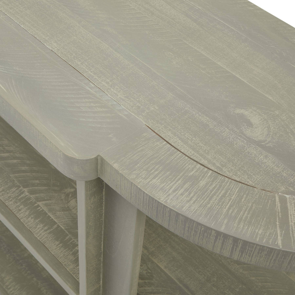 Hand-finished grey-washed pine console table with organic curves, natural wood grain, and contemporary artisan design. by RoomLondon at brixbailey.com
