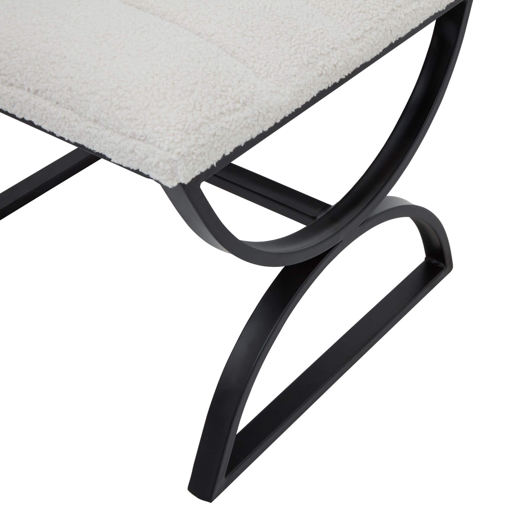 Cream boucle ribbed footstool with black metal frame, curved legs, and textured upholstery for modern interiors by sostter at brixbailey.com