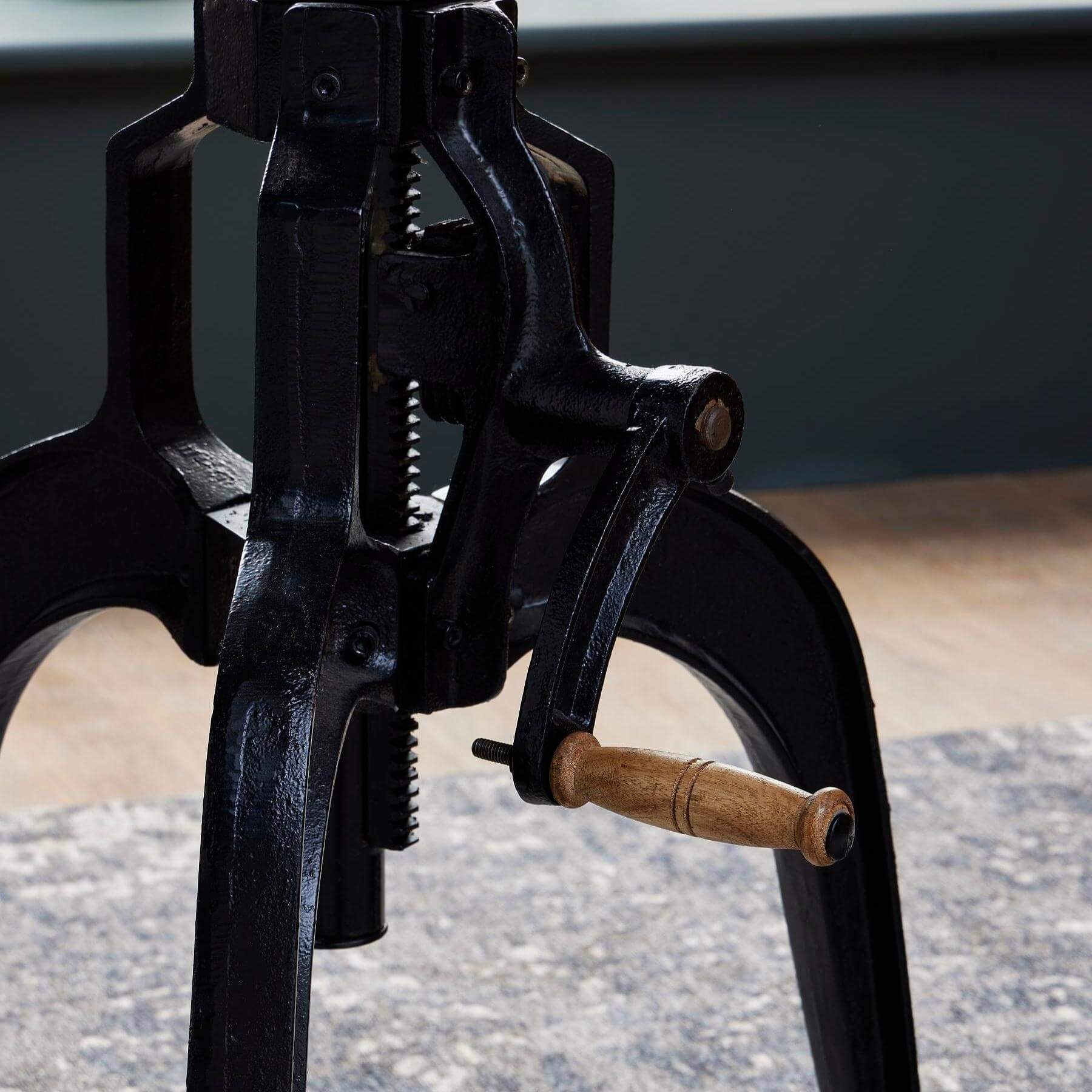 Adjustable industrial bistro table with weathered wood top and black metal frame, perfect for dining or entertaining. by sostter at brixbailey.com