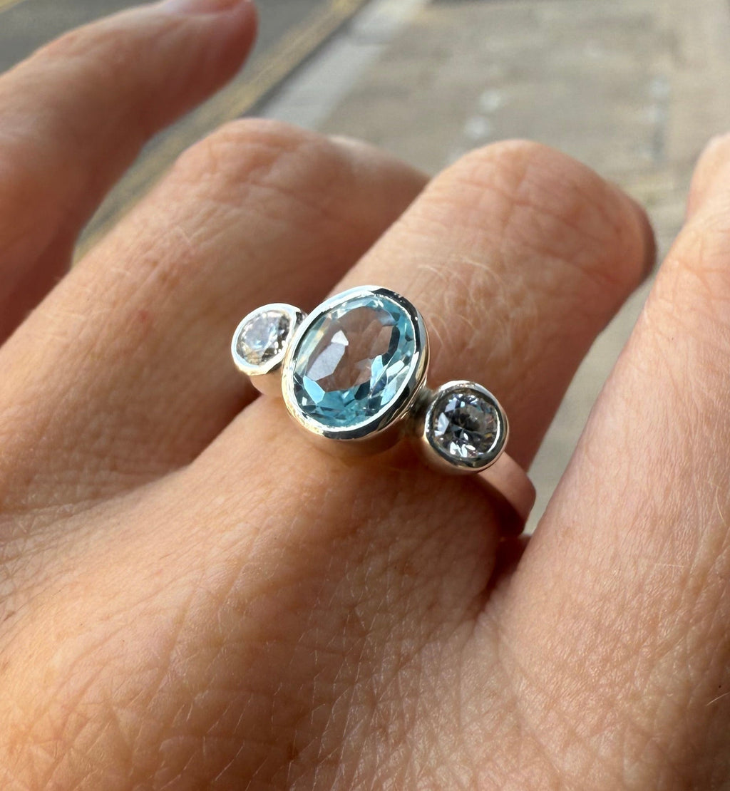 Oval Blue Topaz Trilogy Empire Ring