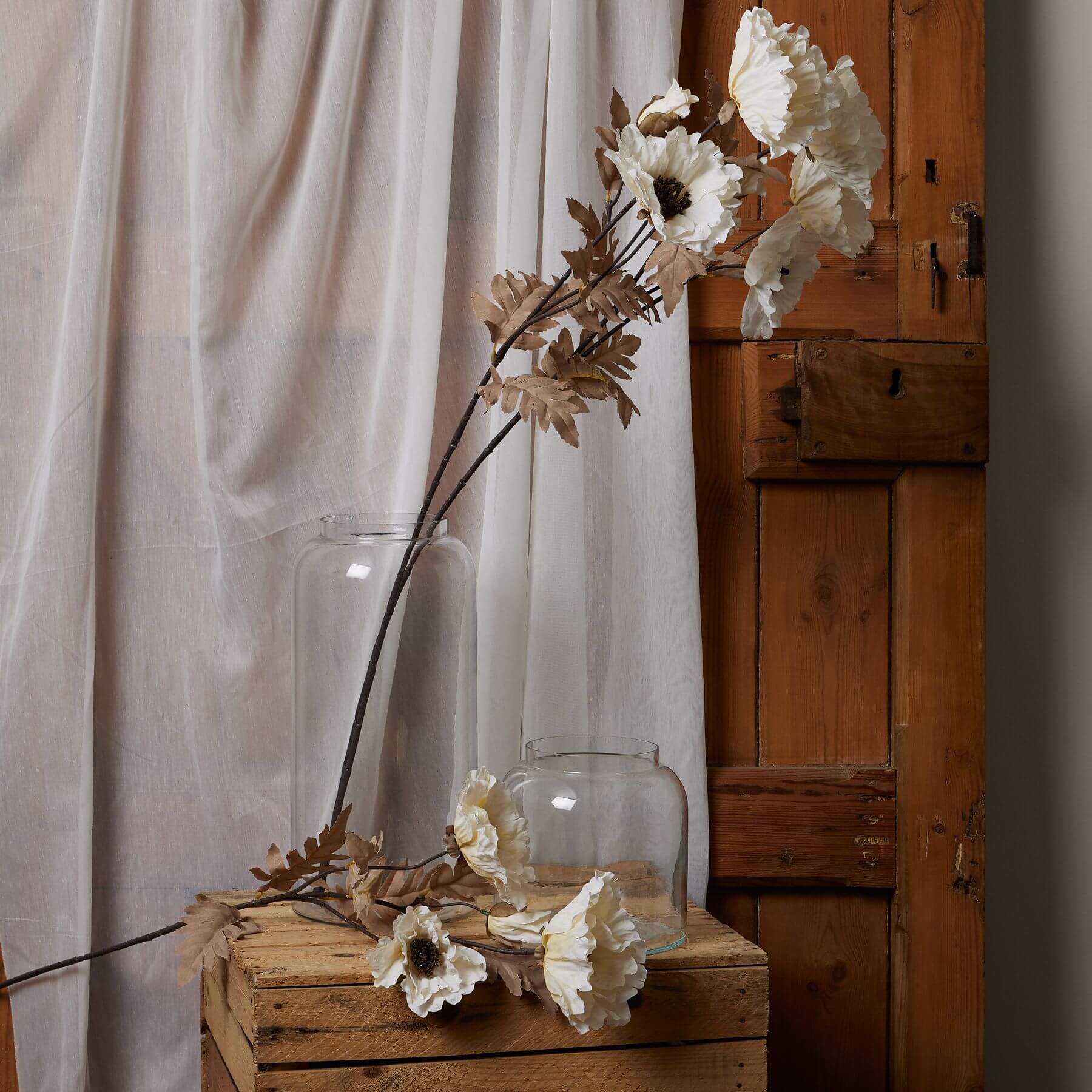 Artificial poppy stem with off-white petals and coffee accents, 105cm tall for elegant home decor  by Sostter at brixbailey.com
