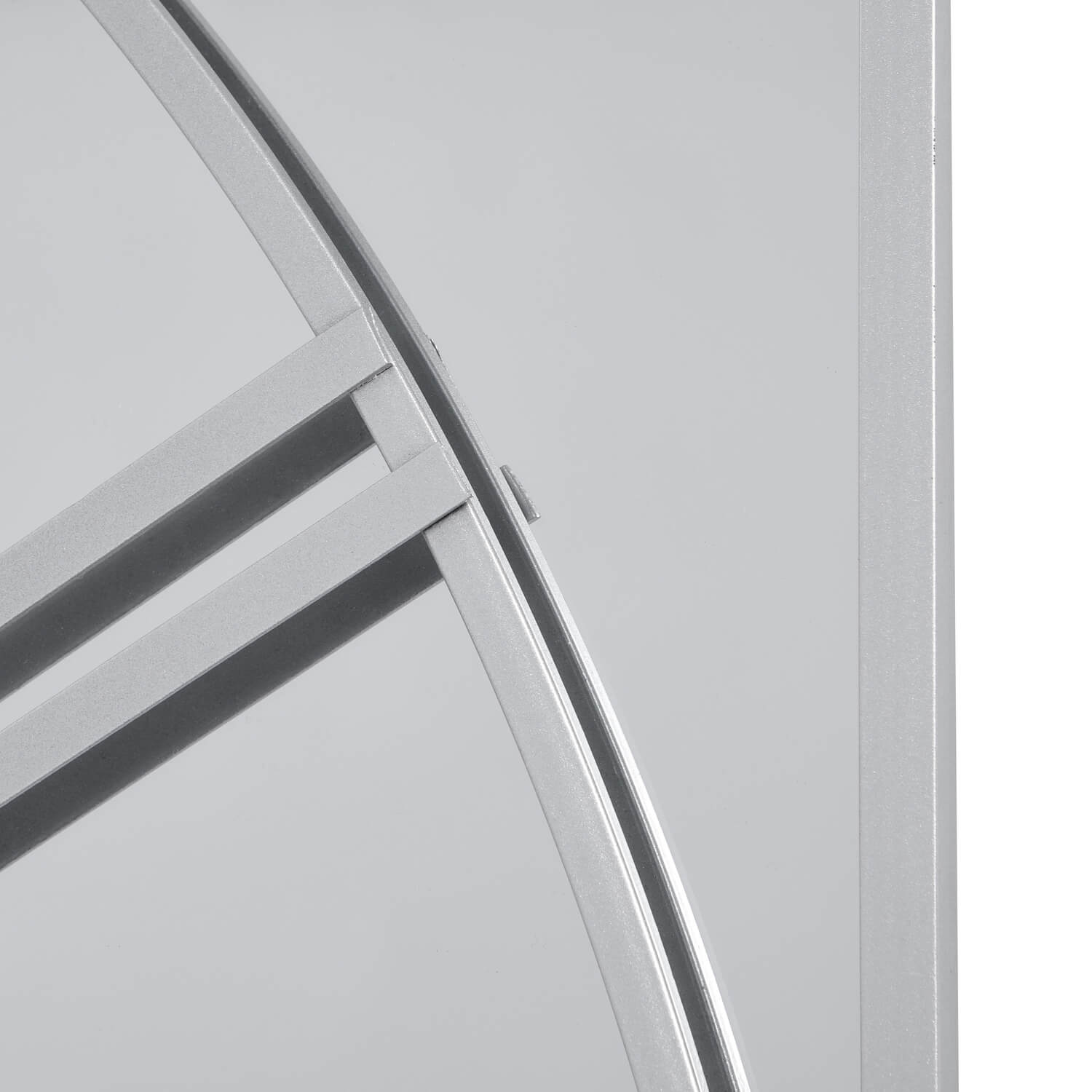 Celina mirrored wall clock with silver metal frame, modern skeleton design, and reflective glass face, 112cm diameter by Sostter at brixbailey.com