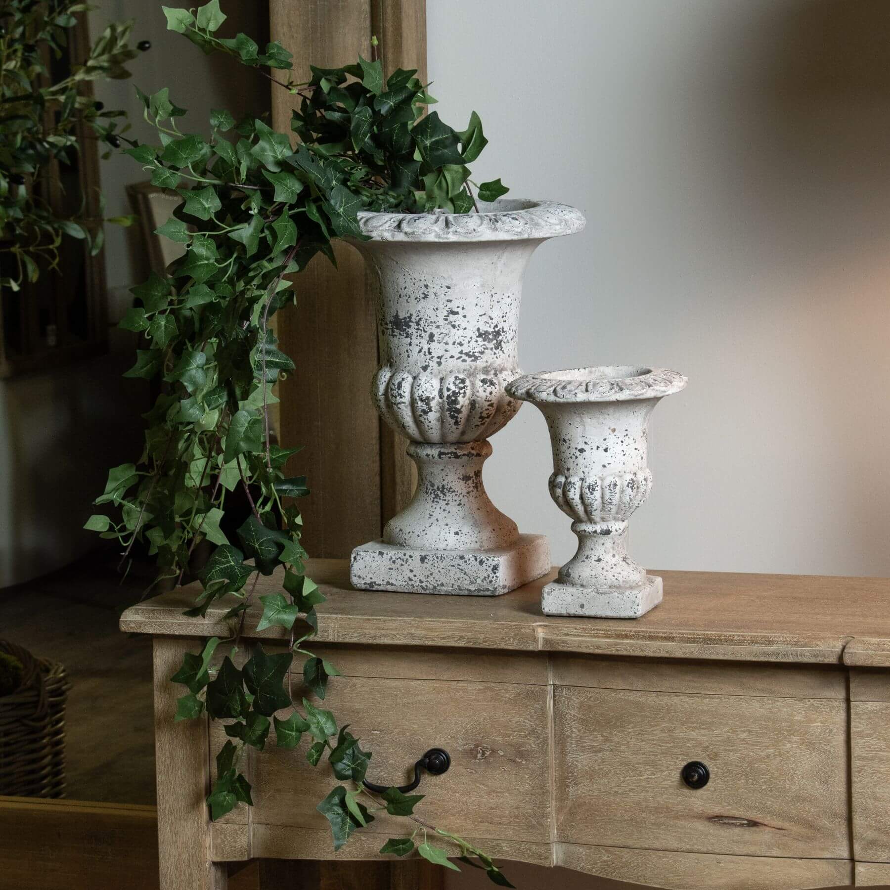 Handcrafted stone-effect ceramic urn with fluted design, neutral color, and classical-modern style for home decor. by RoomLondon at brixbailey.com
