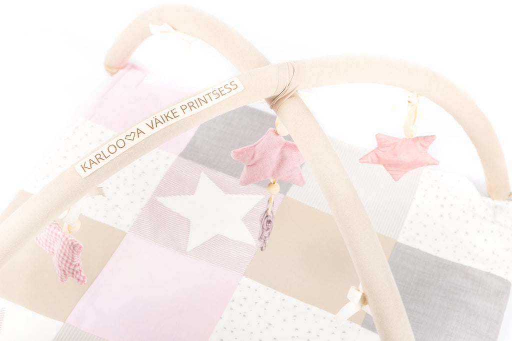 Handmade Baby Activity Mat with Starry Arch – Stimulates Vision & Motor Skills by Karloova at www.brixbailey.com