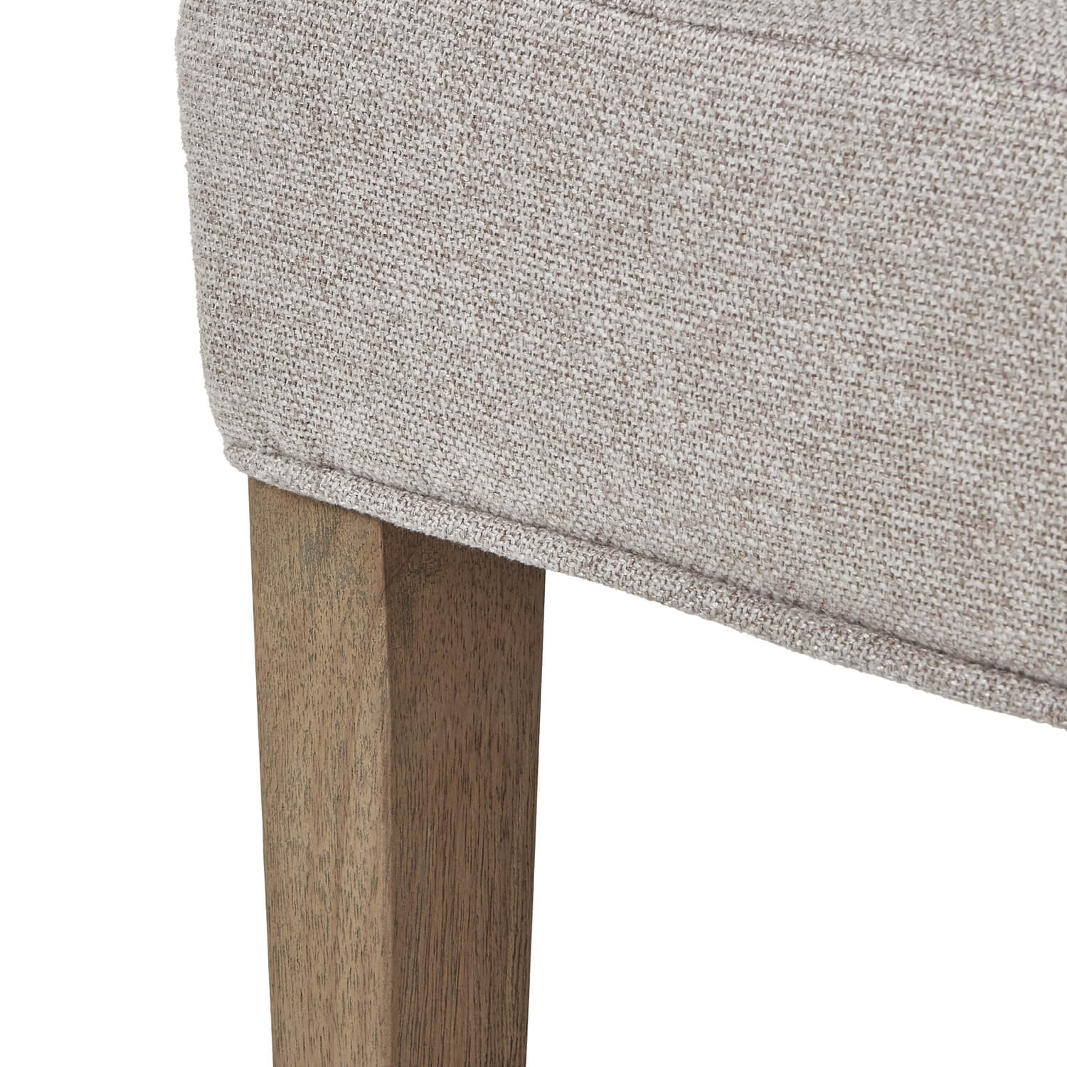 Oatmeal twill dining chair with tufted detailing, curved back, and solid oak legs for elegant comfort. by RoomLondon at brixbailey.com