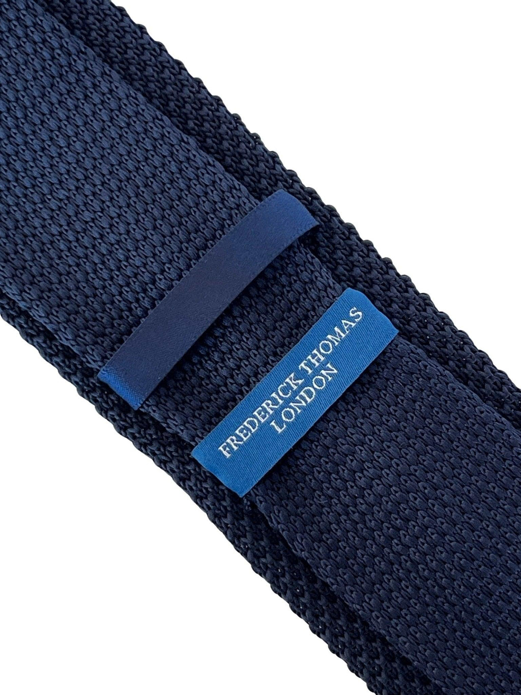 Navy Blue Knitted Tie with White Fleur de Lis Design