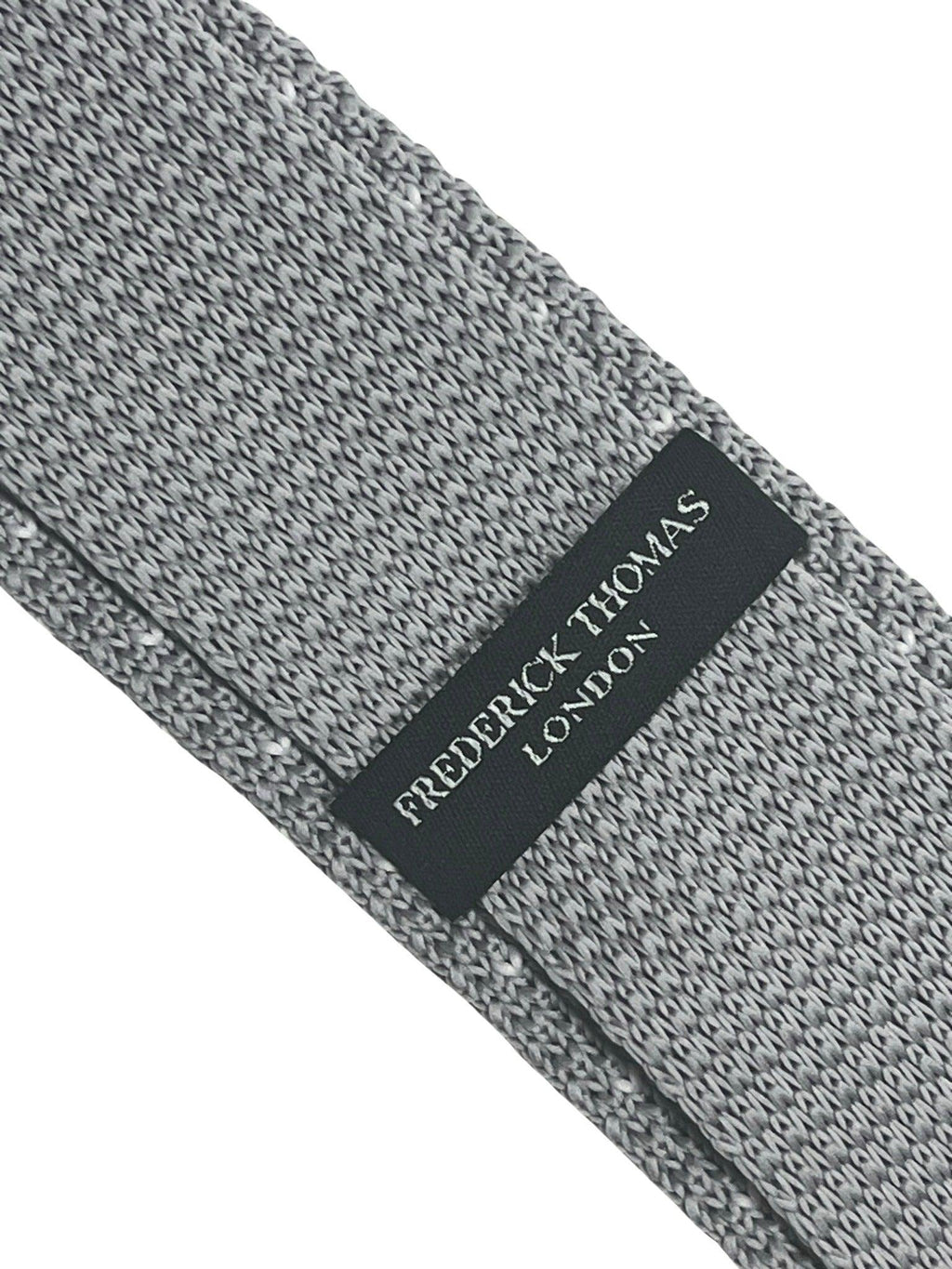 Light silver grey knitted tie with white pin spots