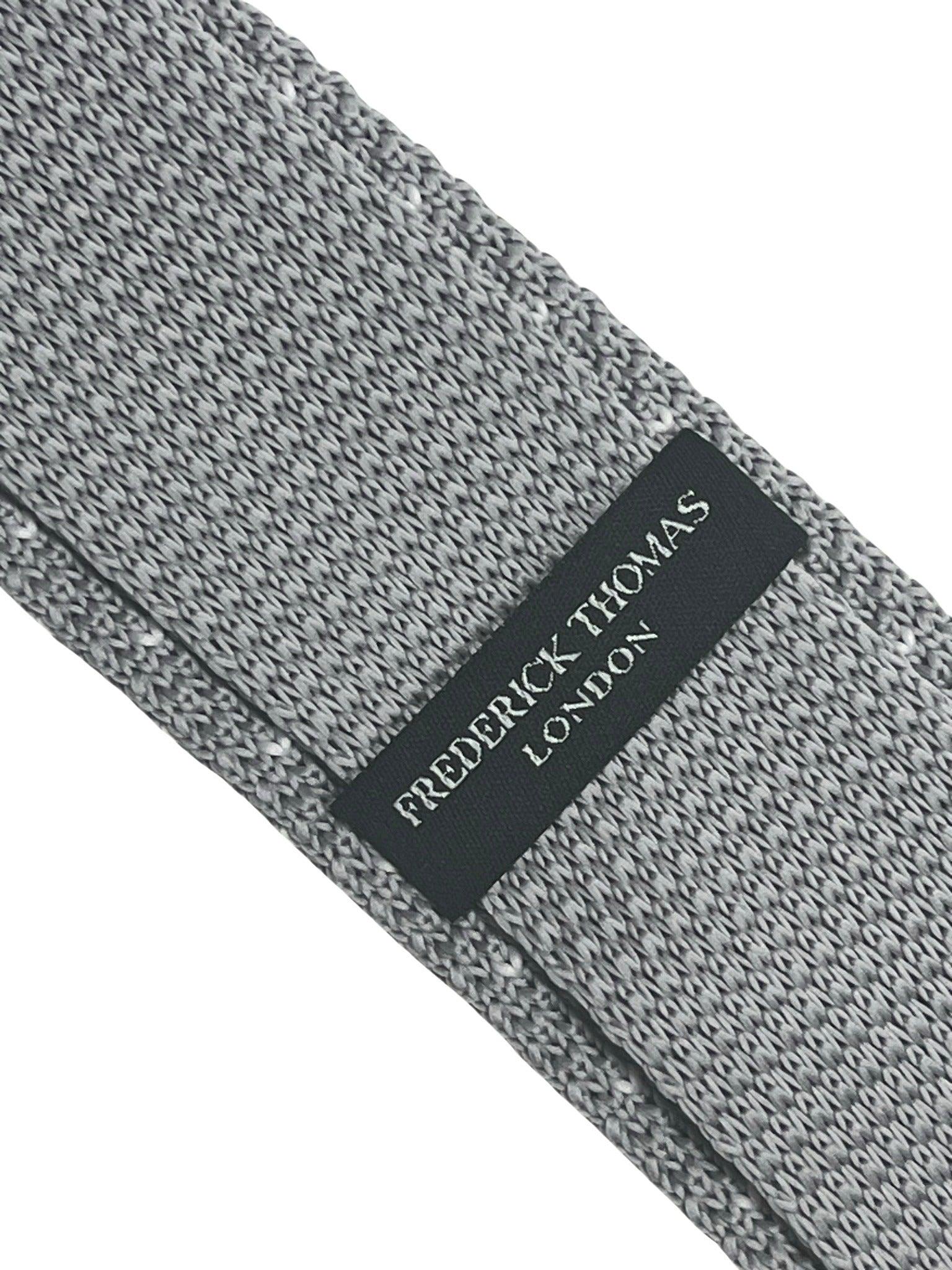 Light silver grey knitted tie with white pin spots