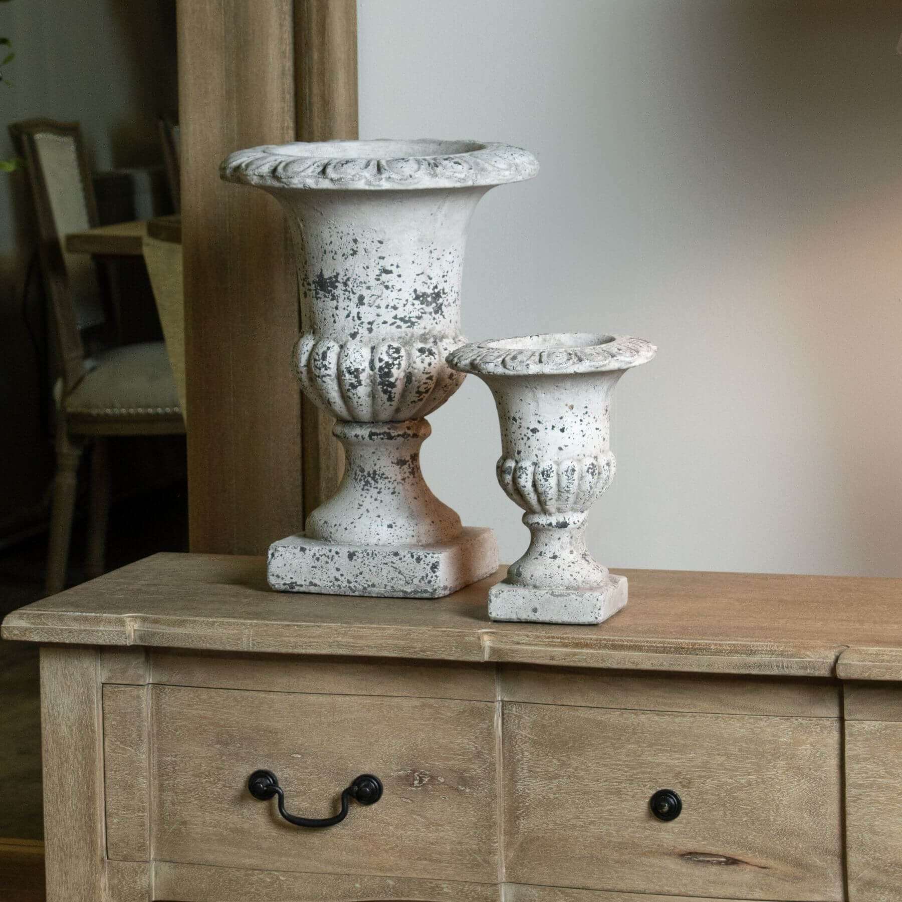 Handcrafted stone-effect ceramic urn with fluted design, neutral color, and classical-modern style for home decor. by RoomLondon at brixbailey.com