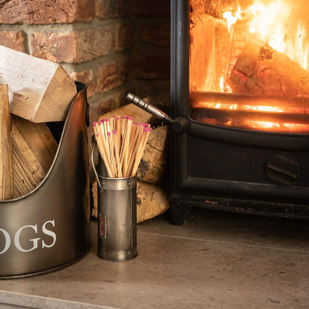 Antique pewter match holder with wood accents, classic silver finish, and integrated striker for fireplace essentials. by RoomLondon at brixbailey.com