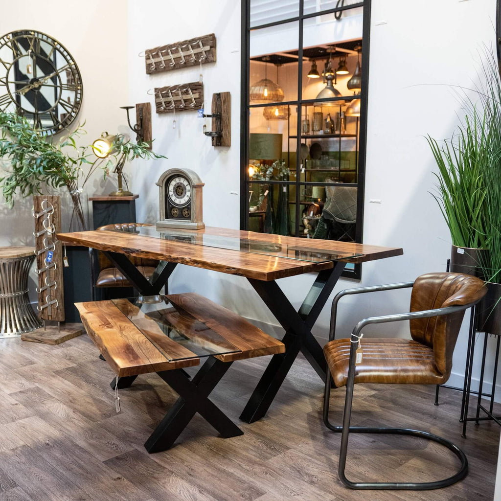 Live edge river dining table with glass center and natural wood edges, warm brown tones, modern rustic design. by Sostter at brixbailey.com