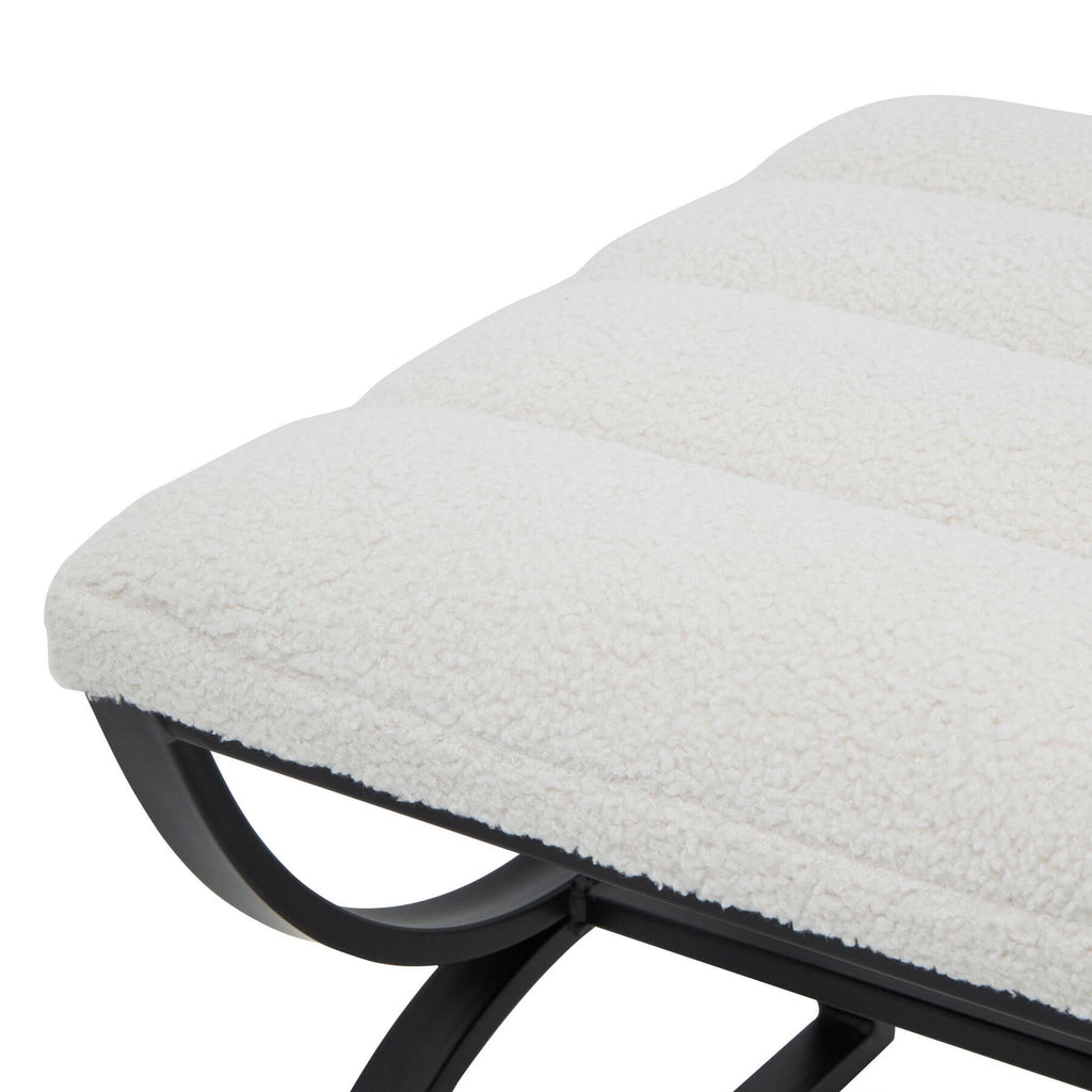 Cream ribbed boucle footstool with black curved metal legs, plush textured upholstery, modern accent piece by sostter at brixbailey.com
