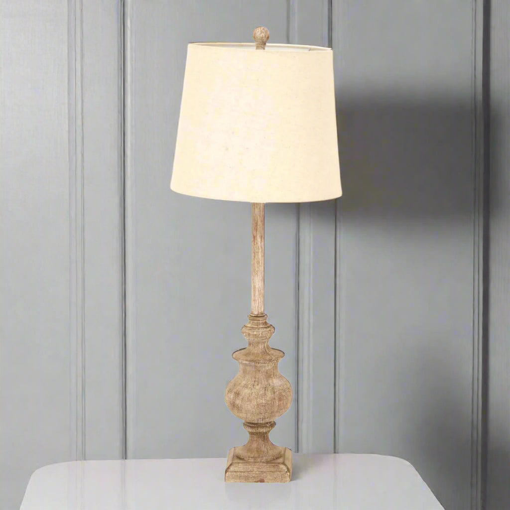 Brown resin candlestick table lamp with linen shade, 80cm tall, for modern or traditional interiors by sostter at brixbailey.com