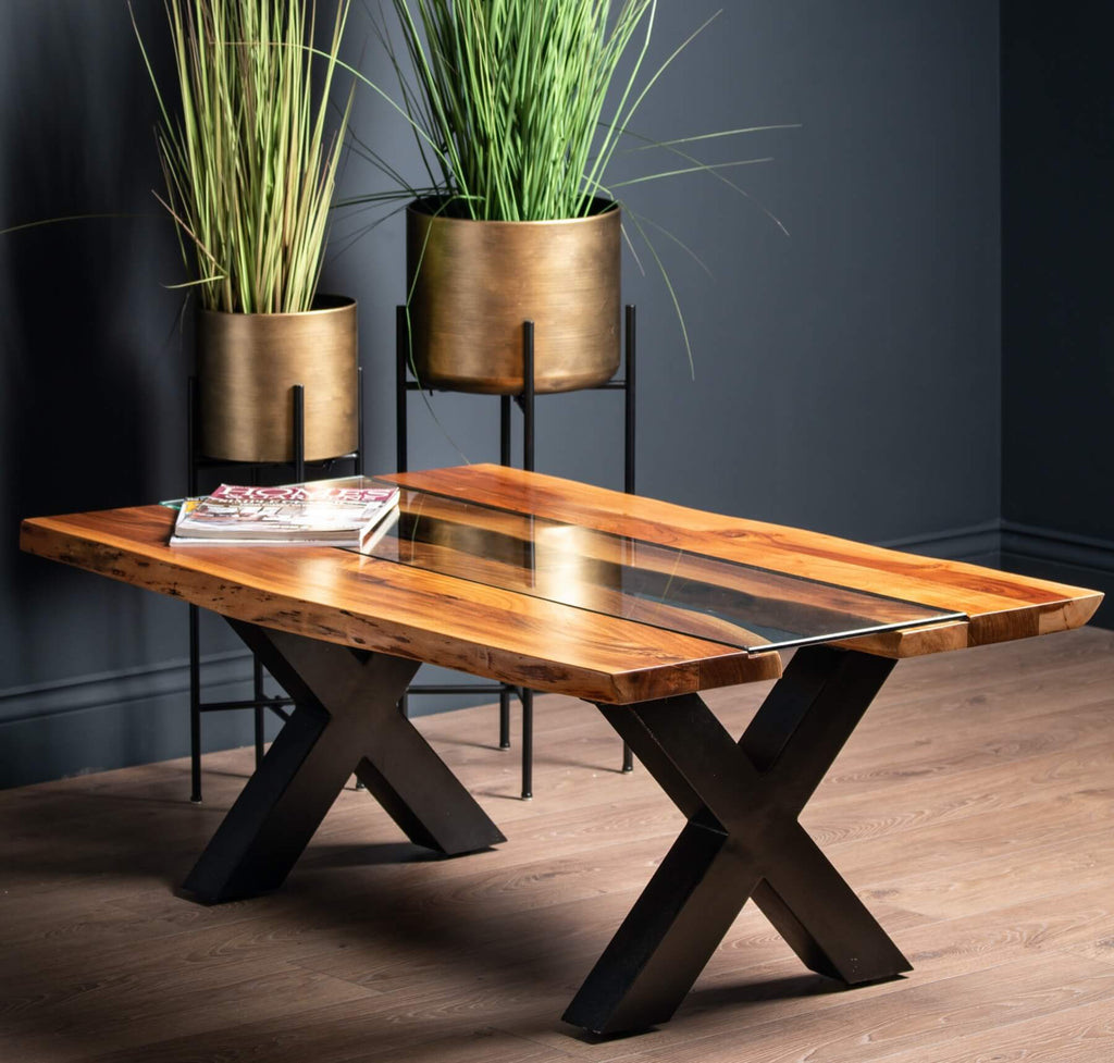 Live edge river dining table with tempered glass center and natural wood edges, warm brown tones, modern rustic design. by RoomLondon at brixbailey.com