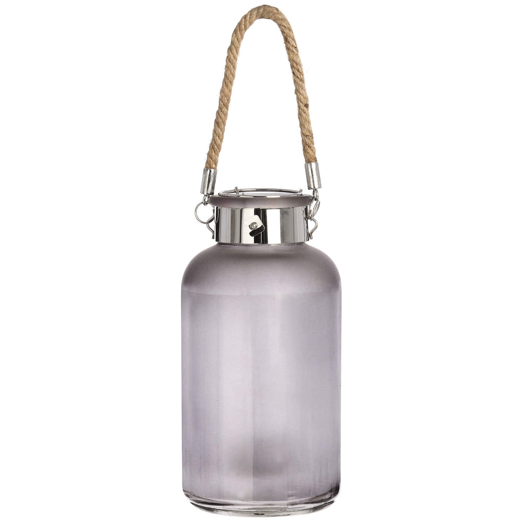 Frosted grey glass lantern with star-like LED glow, natural rope handle, modern rustic design for indoor or outdoor ambiance. by sostter at brixbailey.com