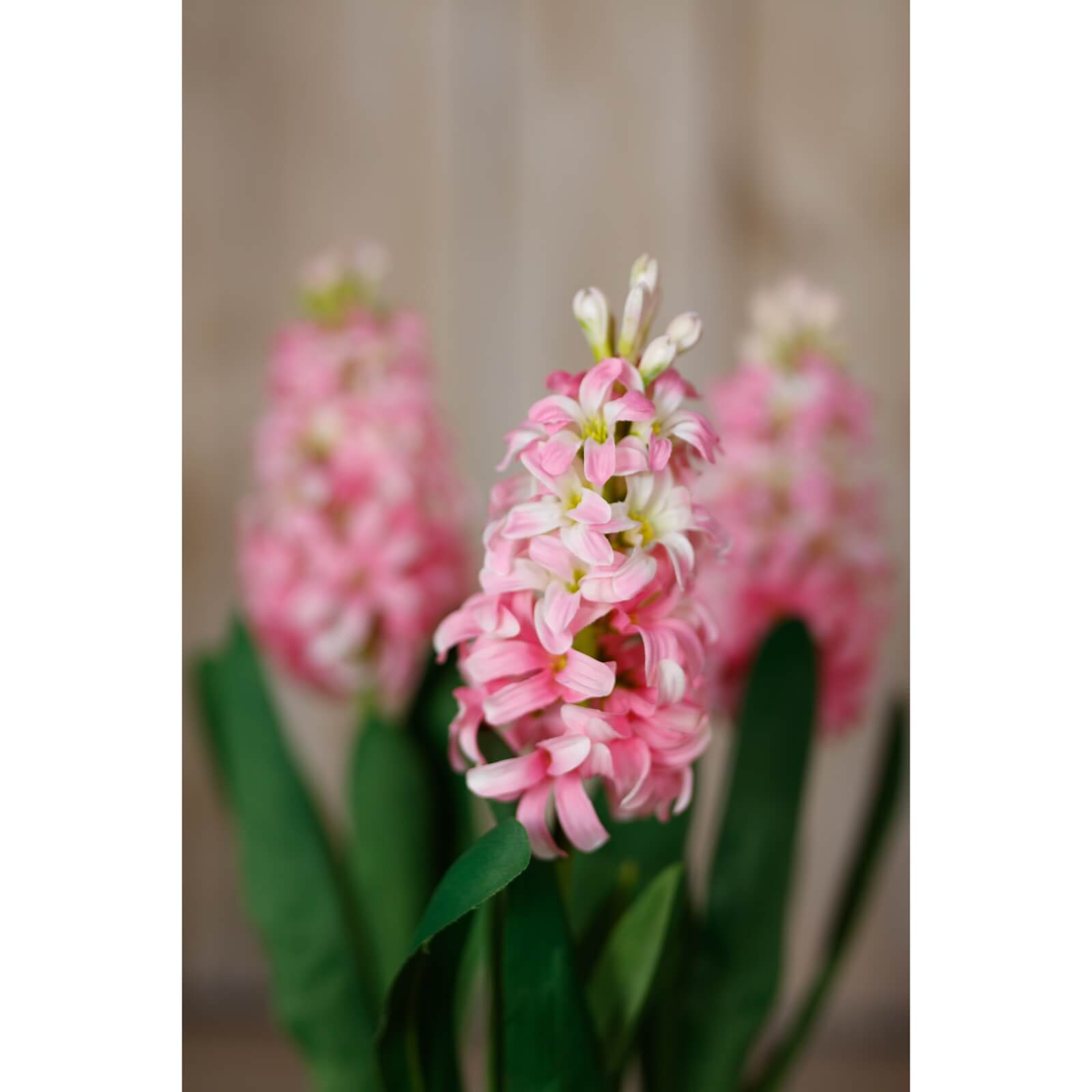 Lifelike pink hyacinth faux stem, soft blush blooms, 44cm tall, perfect for vases or floral arrangements. by sostter at brixbailey.com