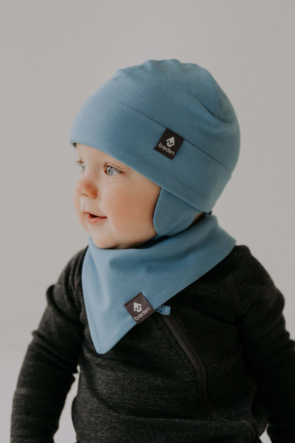 Secure & Cozy MIKA Baby Hat – Merino-Lined with Wind Protection by Breden at brixbailey.com