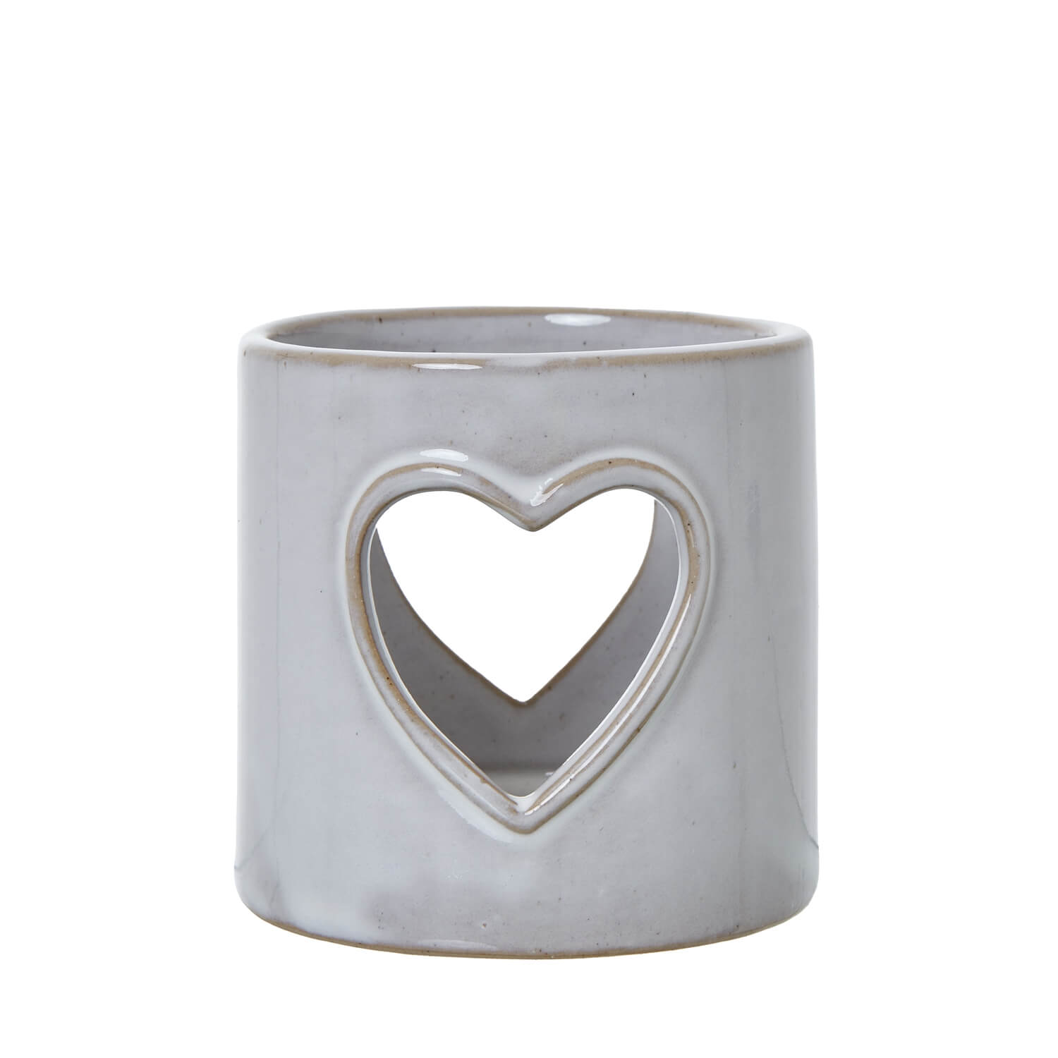 White ceramic tealight holder with heart cutouts, casting romantic light patterns, perfect for home decor and ambiance. by RoomLondon at brixbailey.com