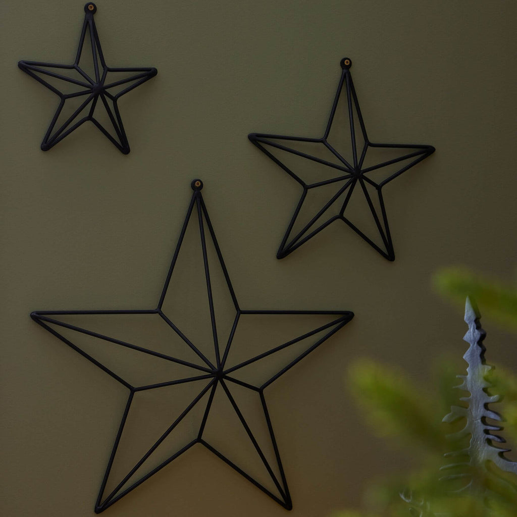 Matte black convex metal star wall art, modern dimensional decor for contemporary or industrial spaces by RoomLondon at brixbailey.com