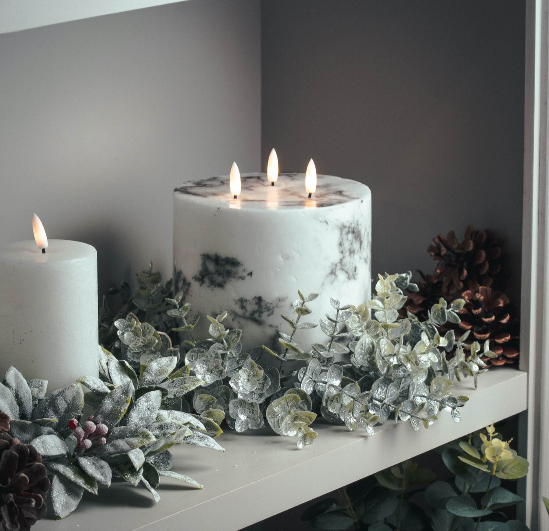 Marble-effect three-wick LED candle with amber flickering flames, neutral white decor accent. by Sostter at brixbailey.com