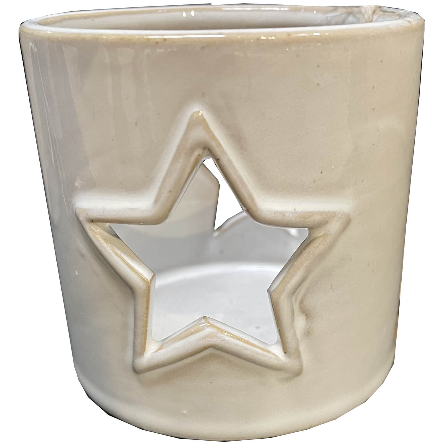 White ceramic tealight holder with star cutouts, casting celestial light patterns on surfaces by Sostter at brixbailey.com