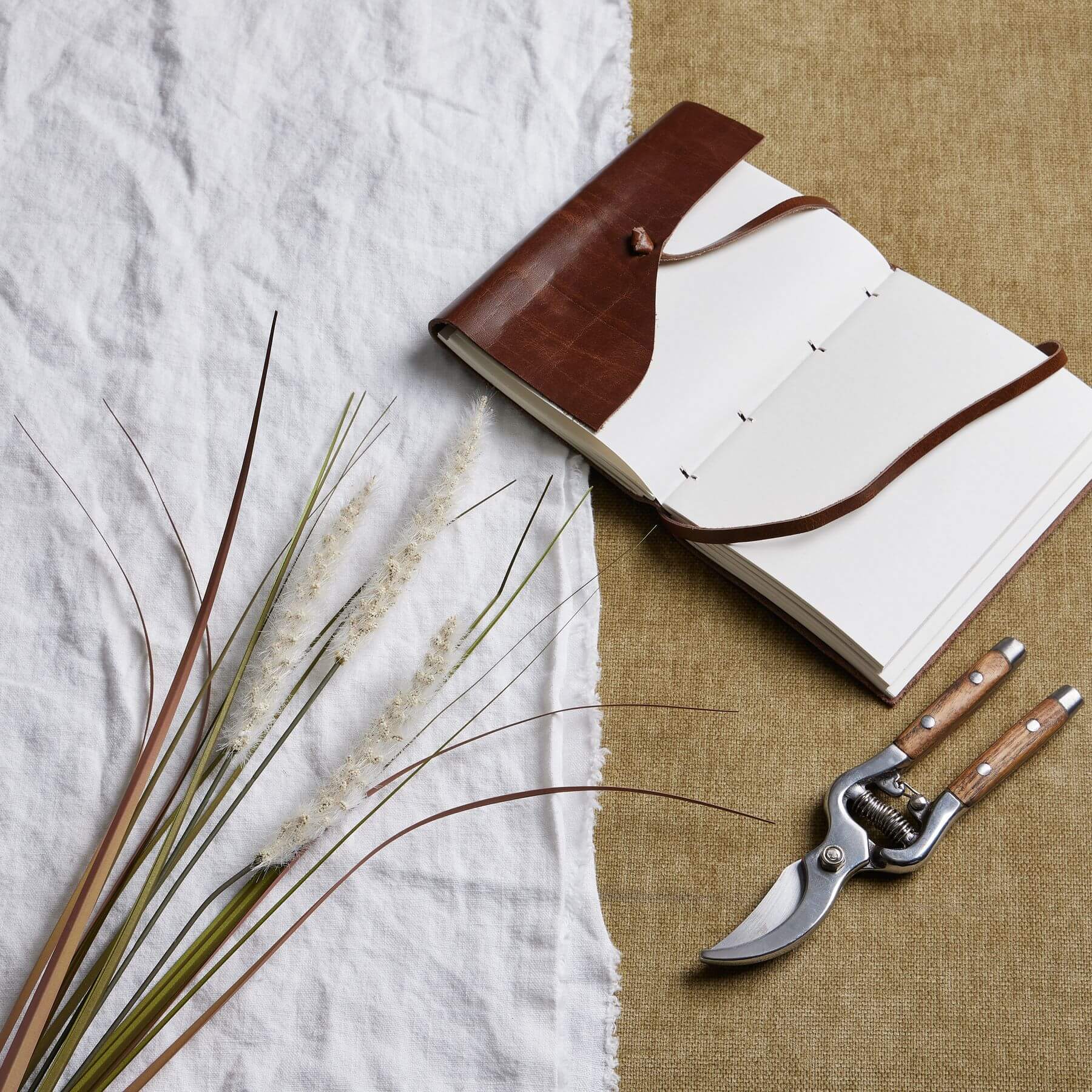 Lifelike artificial grass stems in soft cream, triple-stem design for natural volume, 80cm height, perfect for home decor by RoomLondon at brixbailey.com