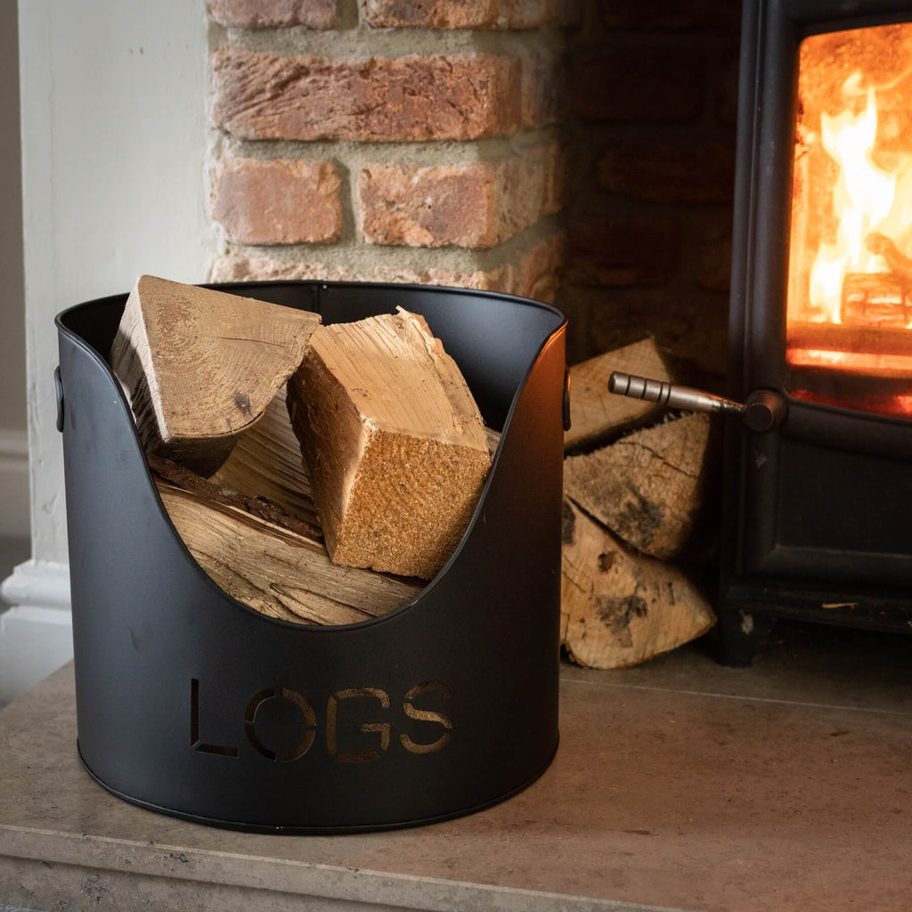 Black metal log and kindling bucket set with modern matte finish, perfect for fireplace storage and organization. by sostter at brixbailey.com