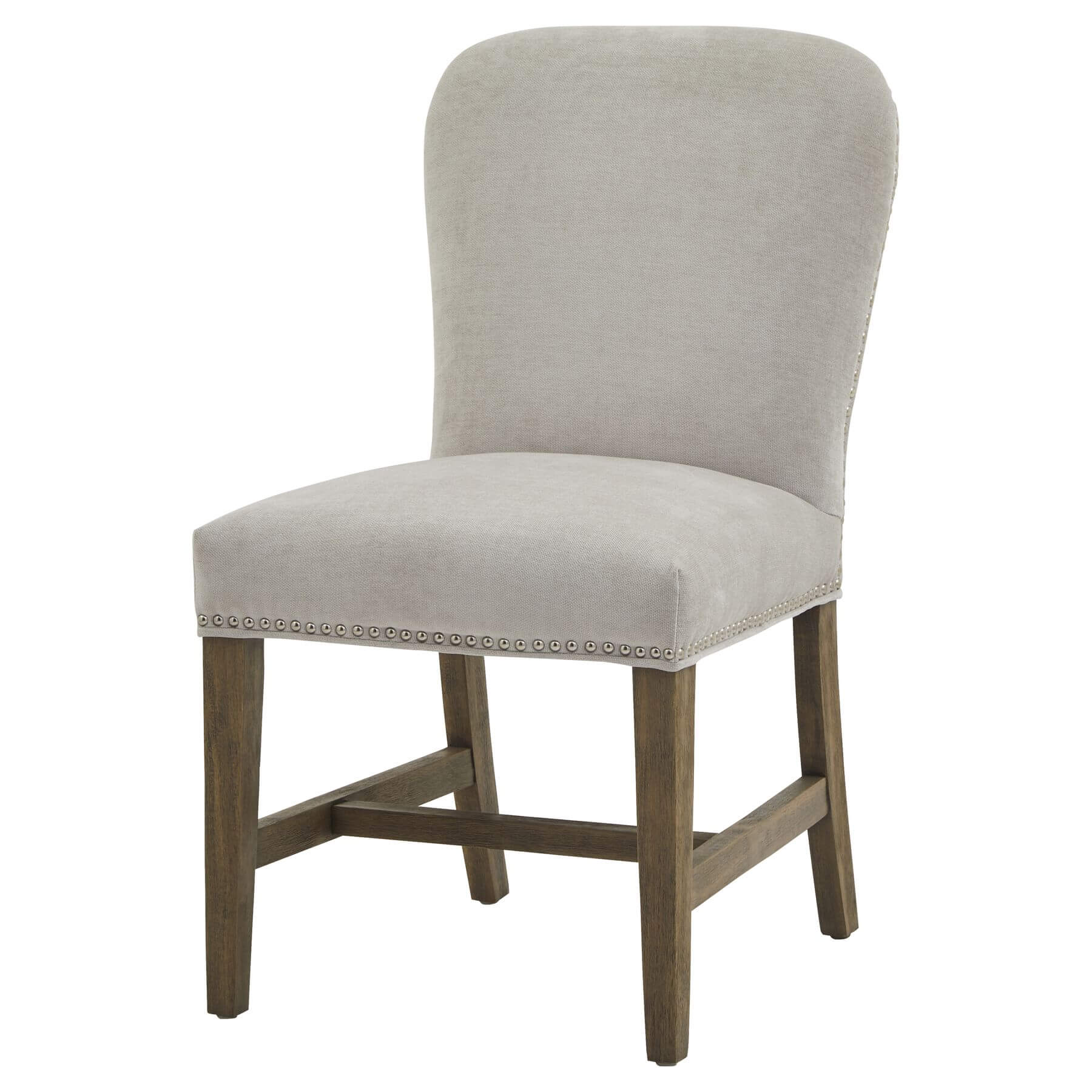 Grey upholstered dining chair with antique brass studs and weathered oak frame in French provincial style by Sostter at brixbailey.com