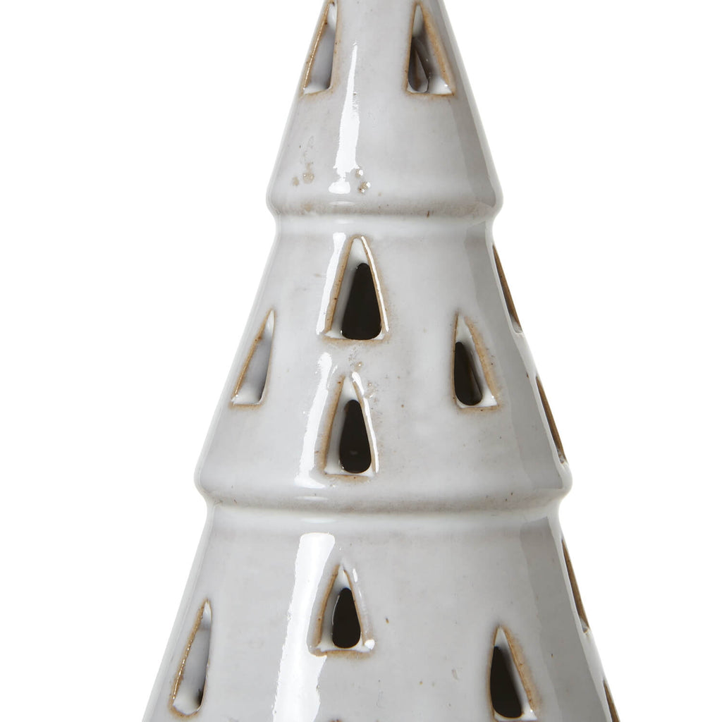 Handcrafted white ceramic LED tree with intricate cut-out patterns, casting warm ambient light for minimalist decor. by sostter at brixbailey.com