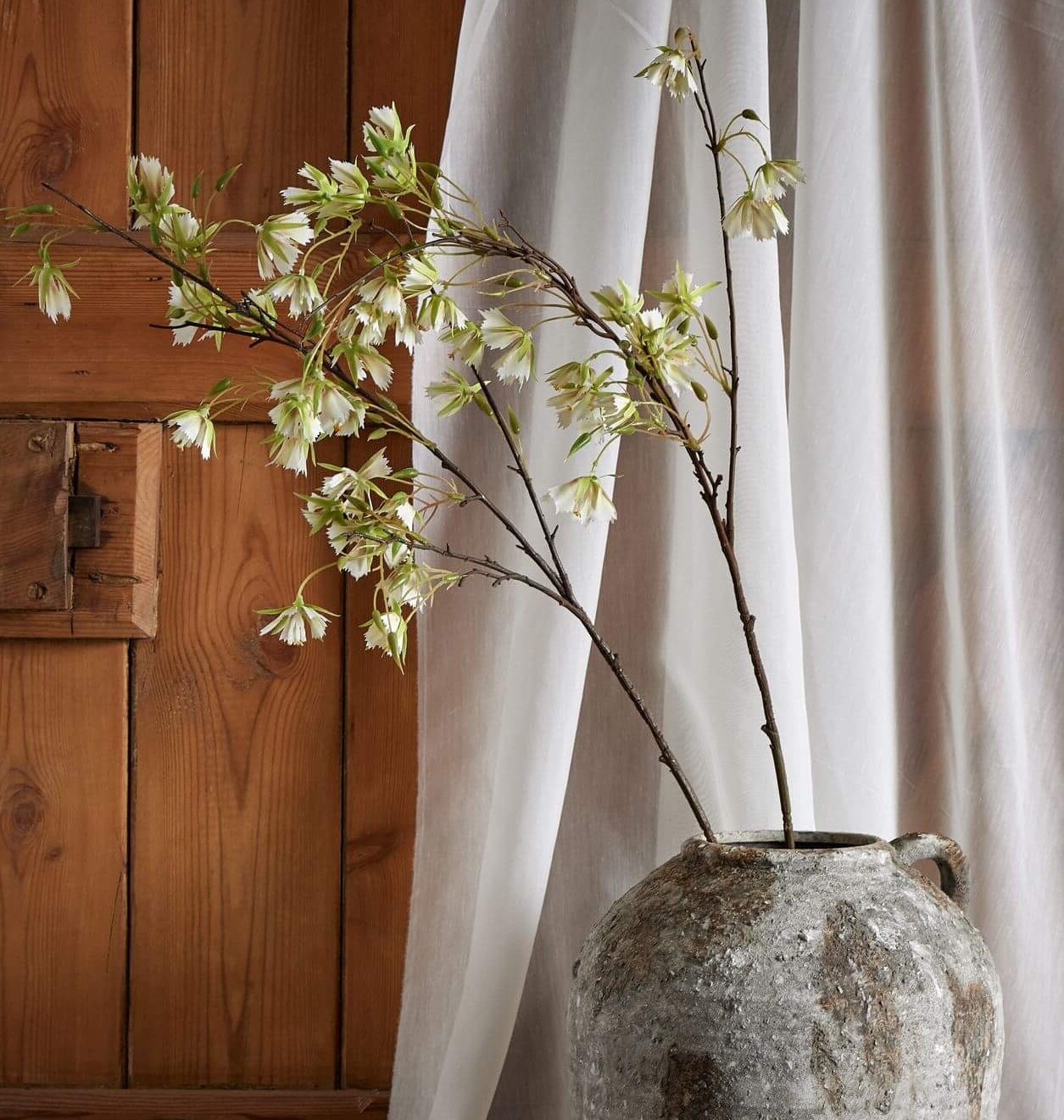 Lifelike artificial Elaeocarpus stem with finely textured green leaves, 100cm tall, for zero-maintenance botanical decor. by sostter at brixbailey.com