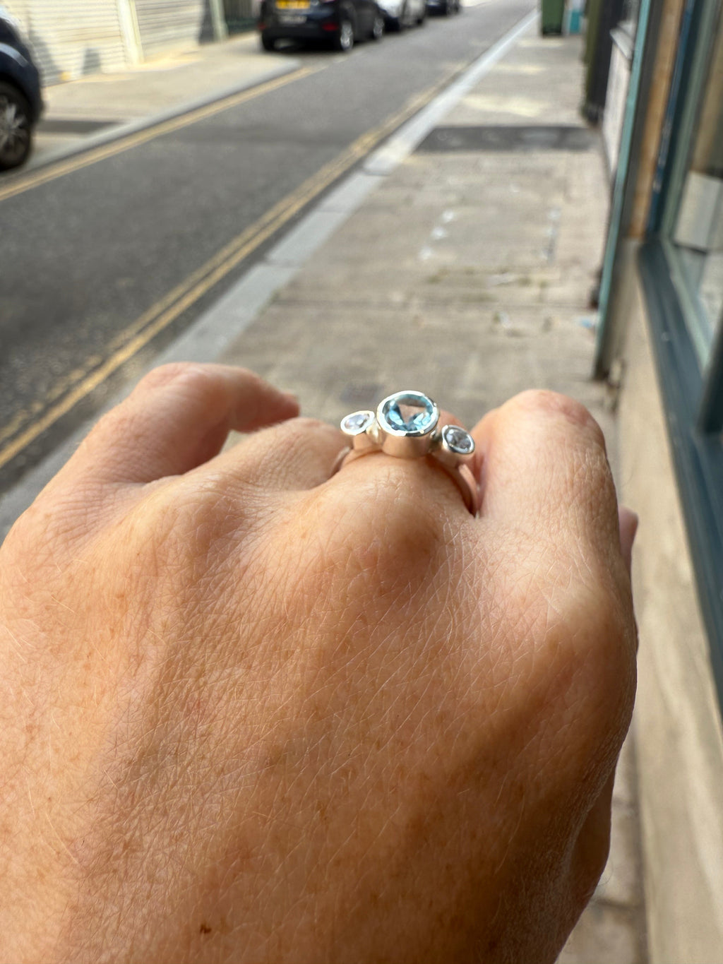 Oval Blue Topaz Trilogy Empire Ring