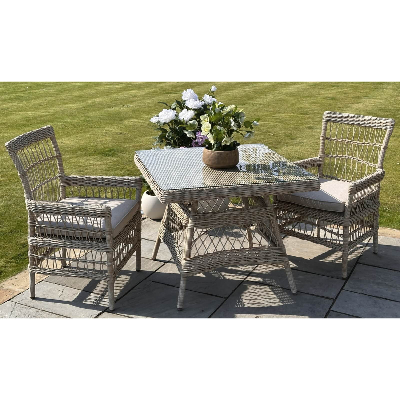 Provence 4-seater outdoor dining set in beige HDPE rattan with tempered glass table and weather-resistant cushions by sostter at brixbailey.com
